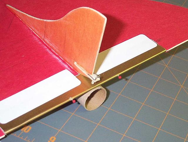 Pushpins in the trailing edge of the elevons. Note the "U" piece of music wire glued to the elevon adjustment tab. It'