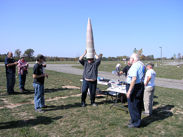 Roger Sadowsky being rewarded for all he does fo the club with a nose cone for his L3 project... or a hat.