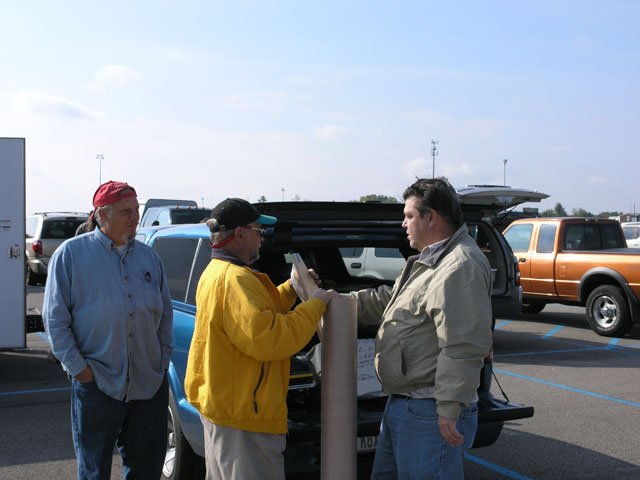 Dave, Chris, and Art looking over some of Art's wares