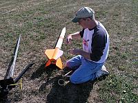 Instally the igniter. You can't see the hands shaking